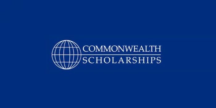 commonwealth scholarship written on blue background besides a globe